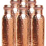 Six Hammered Copper Bottles