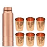 One Plain Copper Bottle And Six Hammered Copper Glasses