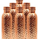 Six Hammered Copper Bottles