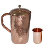 One Hammered Copper Jug And One Plain Copper Glass