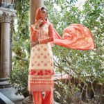 3309Ivory and Orange Party Wear Faux Georgette or Net Straight Suit